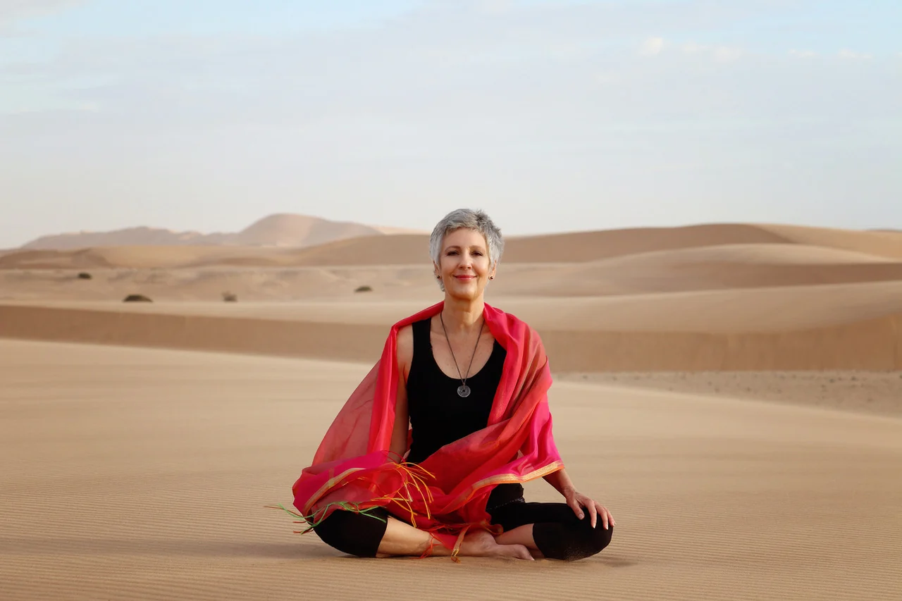 Gabi seated calmly among the Namib dunes